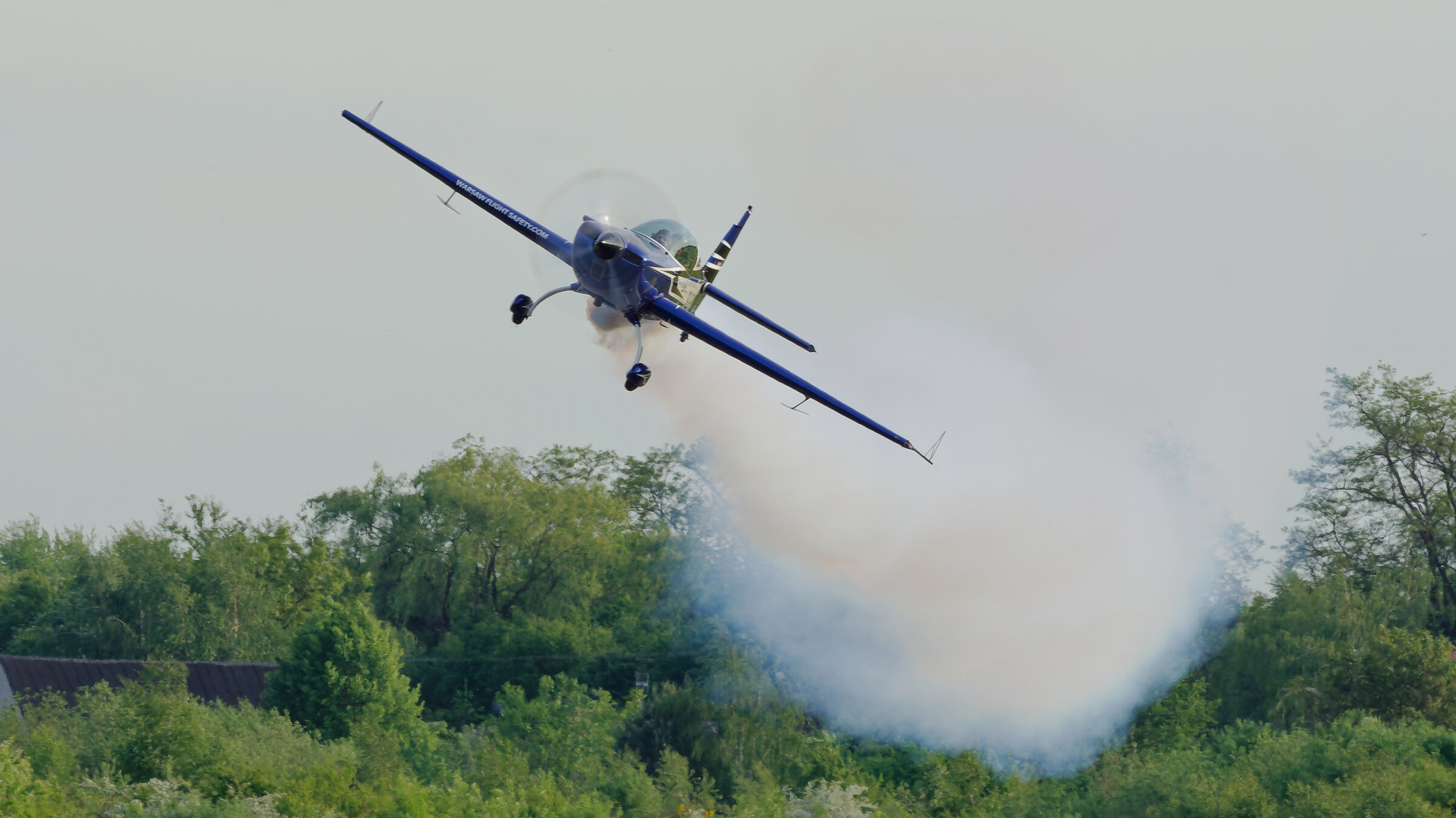 Extra 300L SP-EKS over the landscape