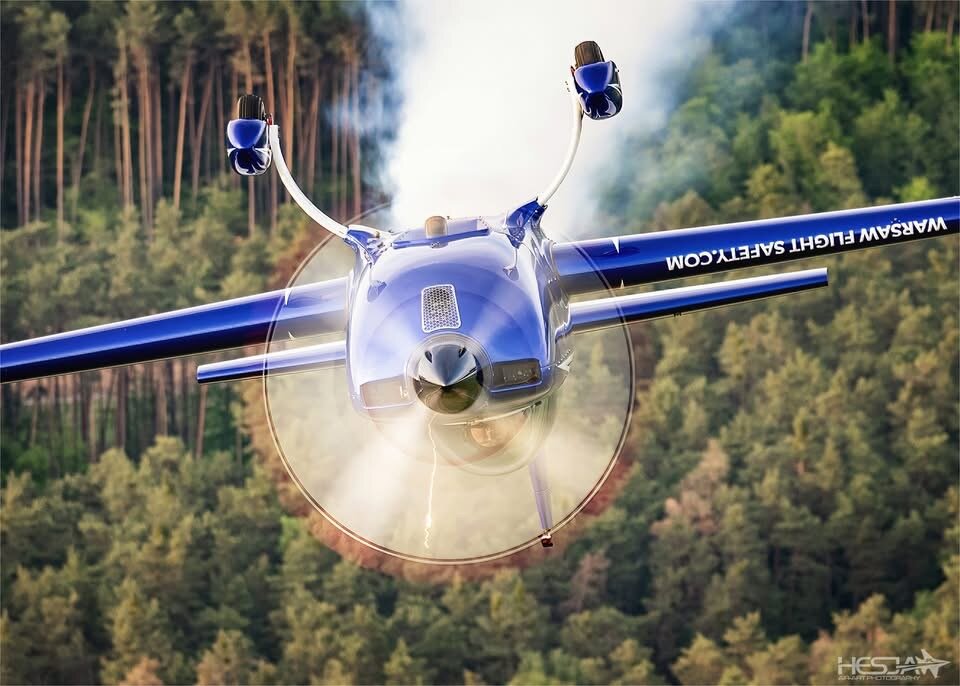 SP-EKS head-on trailing smoke over a forest