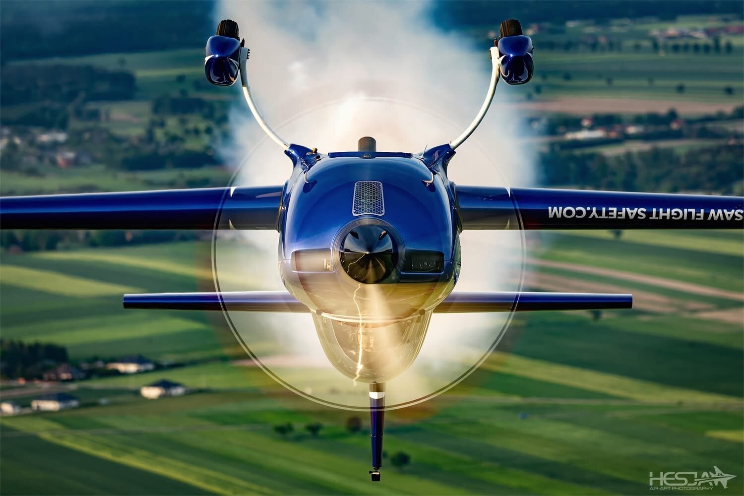 Extra 300L SP-EKS in a dive with smoke on