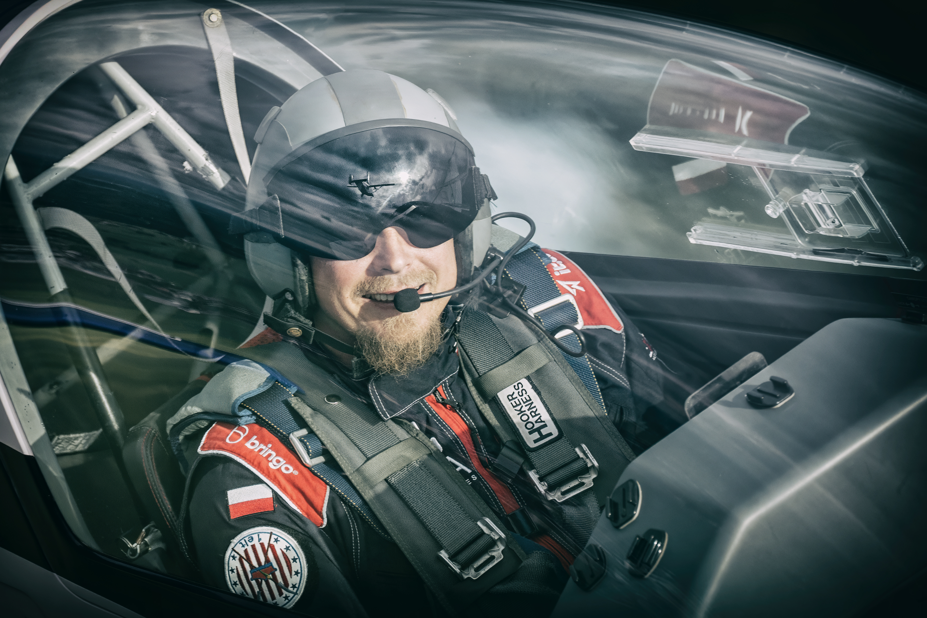 Maciej Kulaszewski — aerobatic pilot Extra 300L in cockpit
